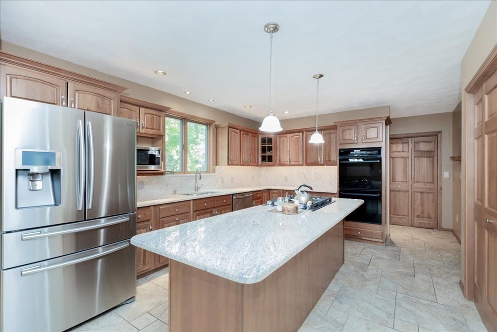 24 Campbell Road Middleton, MA 01949 - Photo 19 of 41 a kitchen with stainless steel appliances granite countertop a sink a refrigerator and a stove
