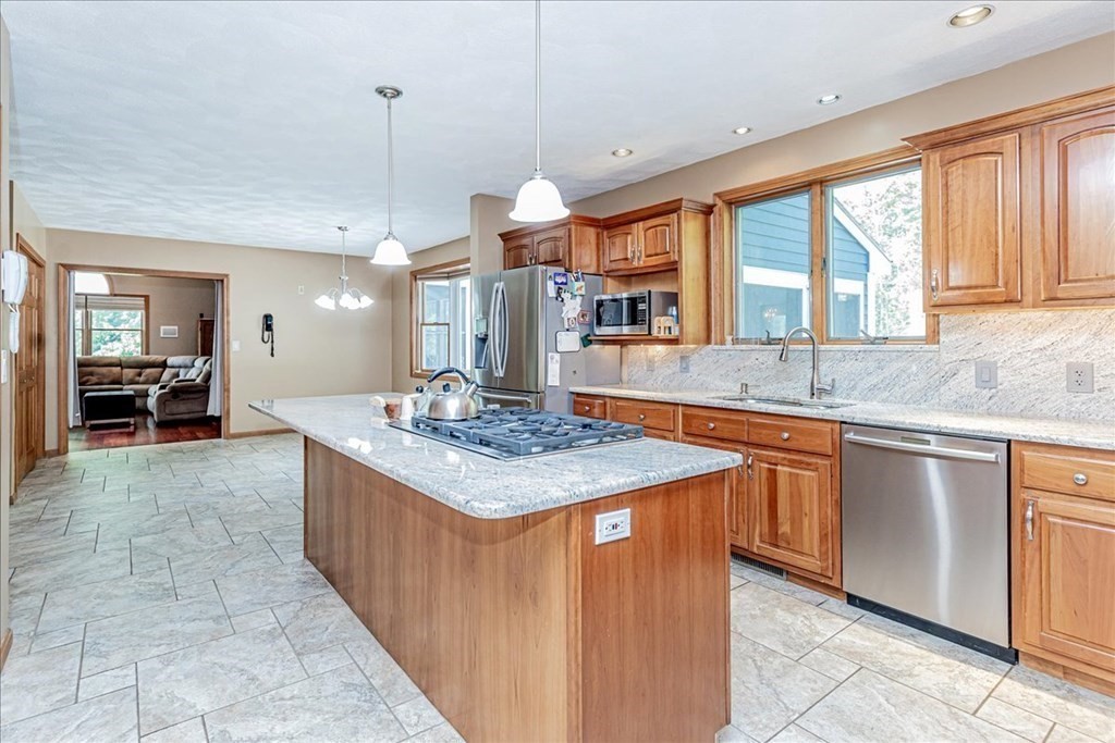24 Campbell Road Middleton, MA 01949 - Photo 21 of 41 a kitchen with stainless steel appliances granite countertop a sink and a large window