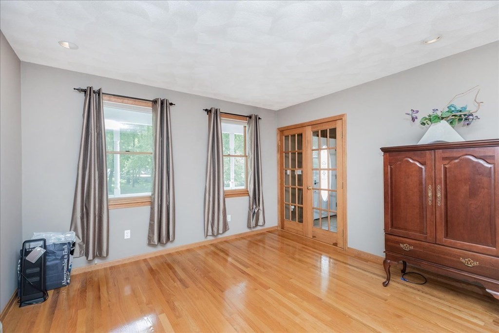 24 Campbell Road Middleton, MA 01949 - Photo 27 of 41 a bedroom with a bed and wooden floor