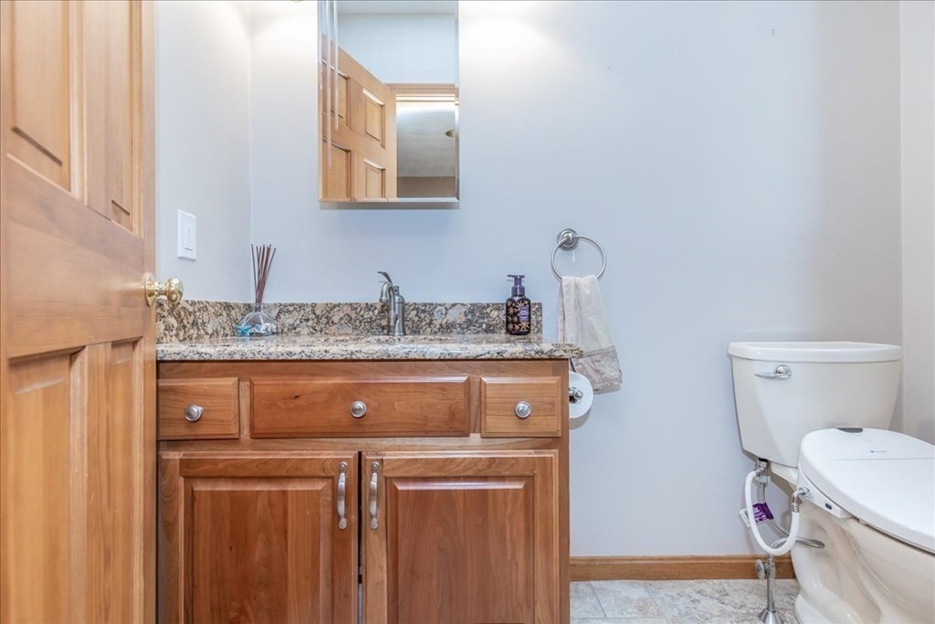24 Campbell Road Middleton, MA 01949 - Photo 28 of 41 a bathroom with a sink and a toilet