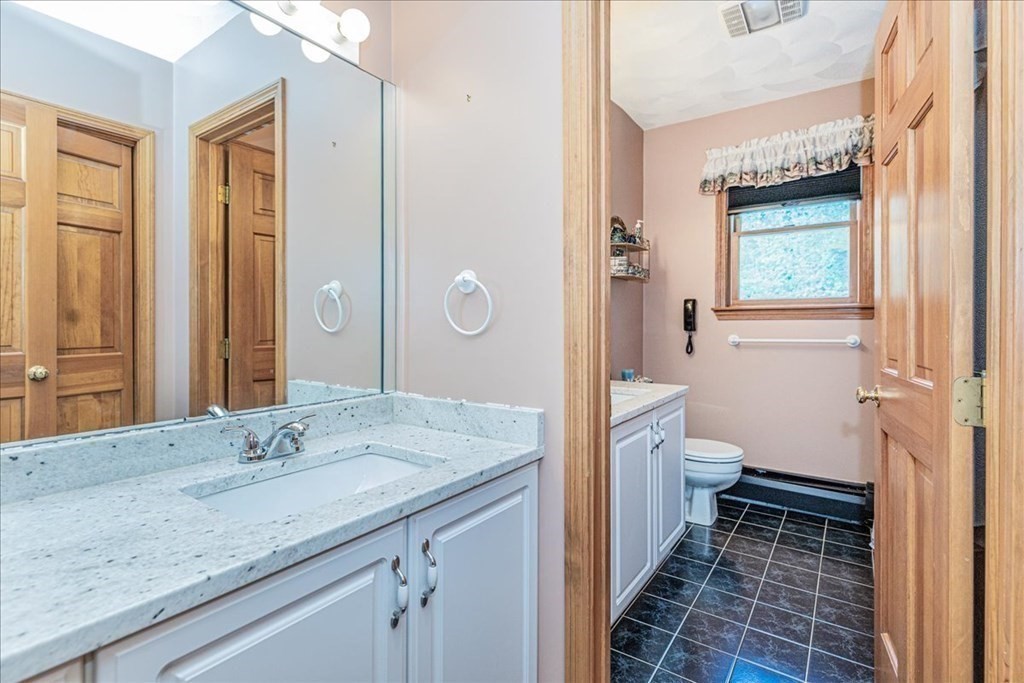24 Campbell Road Middleton, MA 01949 - Photo 34 of 41 a bathroom with a granite countertop sink toilet and shower