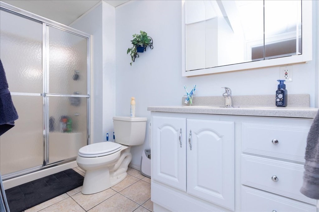 24 Campbell Road Middleton, MA 01949 - Photo 40 of 41 a bathroom with a sink a toilet and vanity