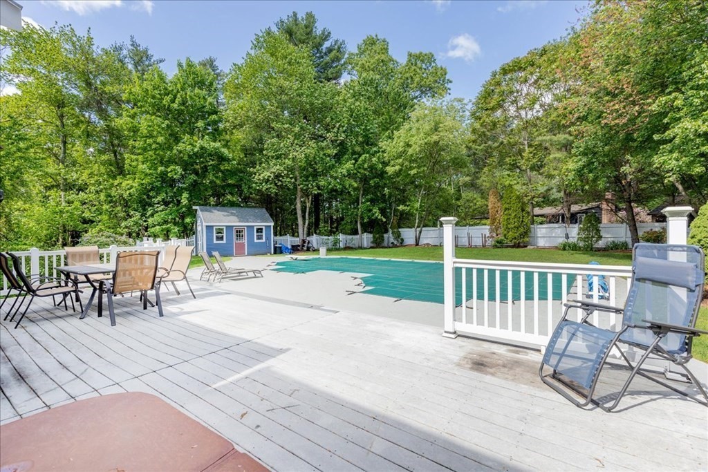 24 Campbell Road Middleton, MA 01949 - Photo 8 of 41 a view of a chairs and table on the wooden floor