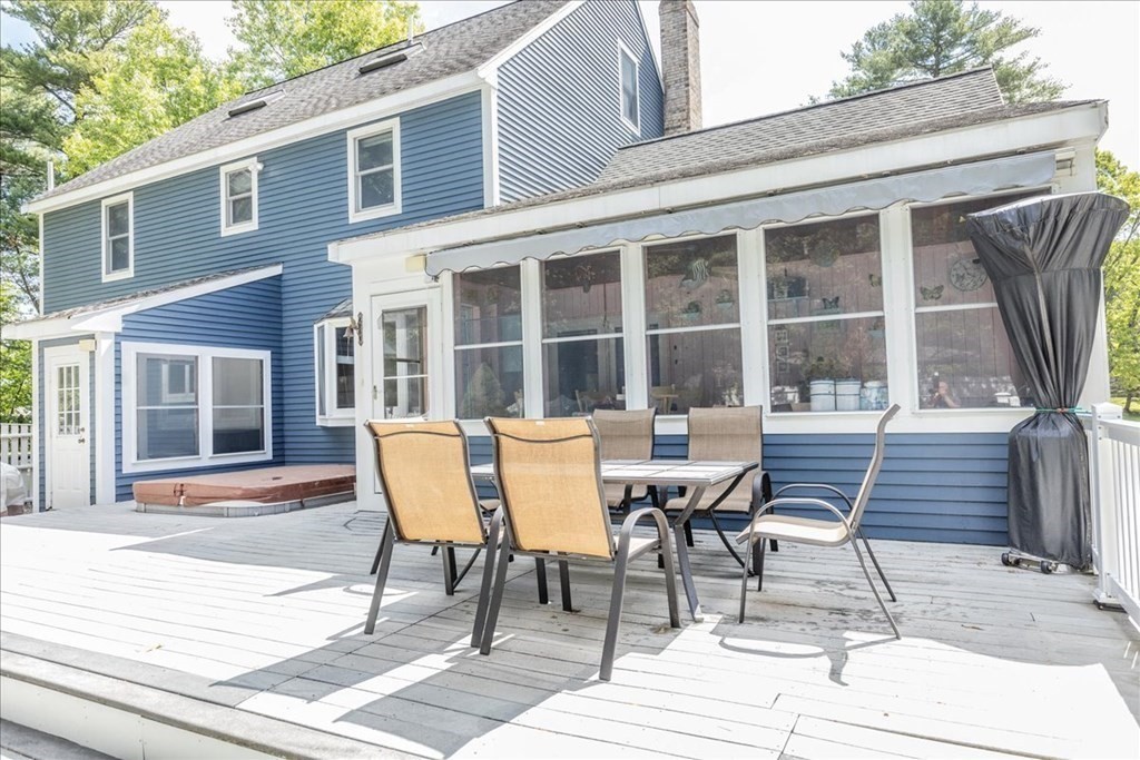 24 Campbell Road Middleton, MA 01949 - Photo 10 of 41 a wooden bench sitting in front of a building