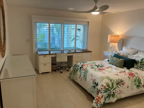 a bedroom with a bed and a table in it