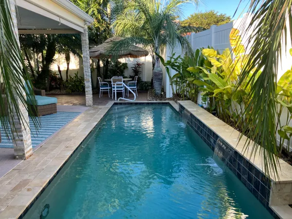 a view of swimming pool with a patio