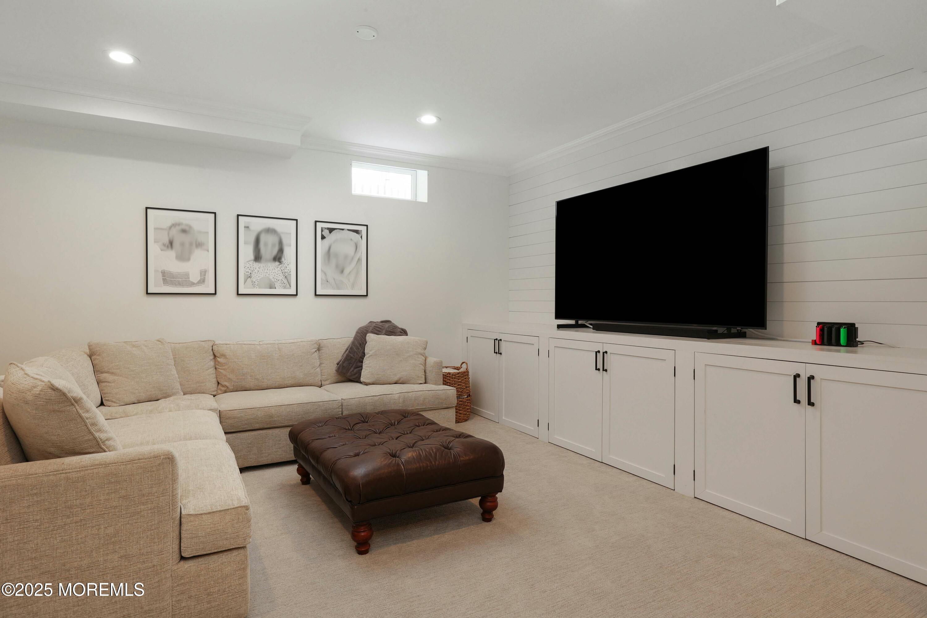 105 Black Point Road Rumson, NJ 07760 - Photo 24 of 33 a living room with furniture and a flat screen tv