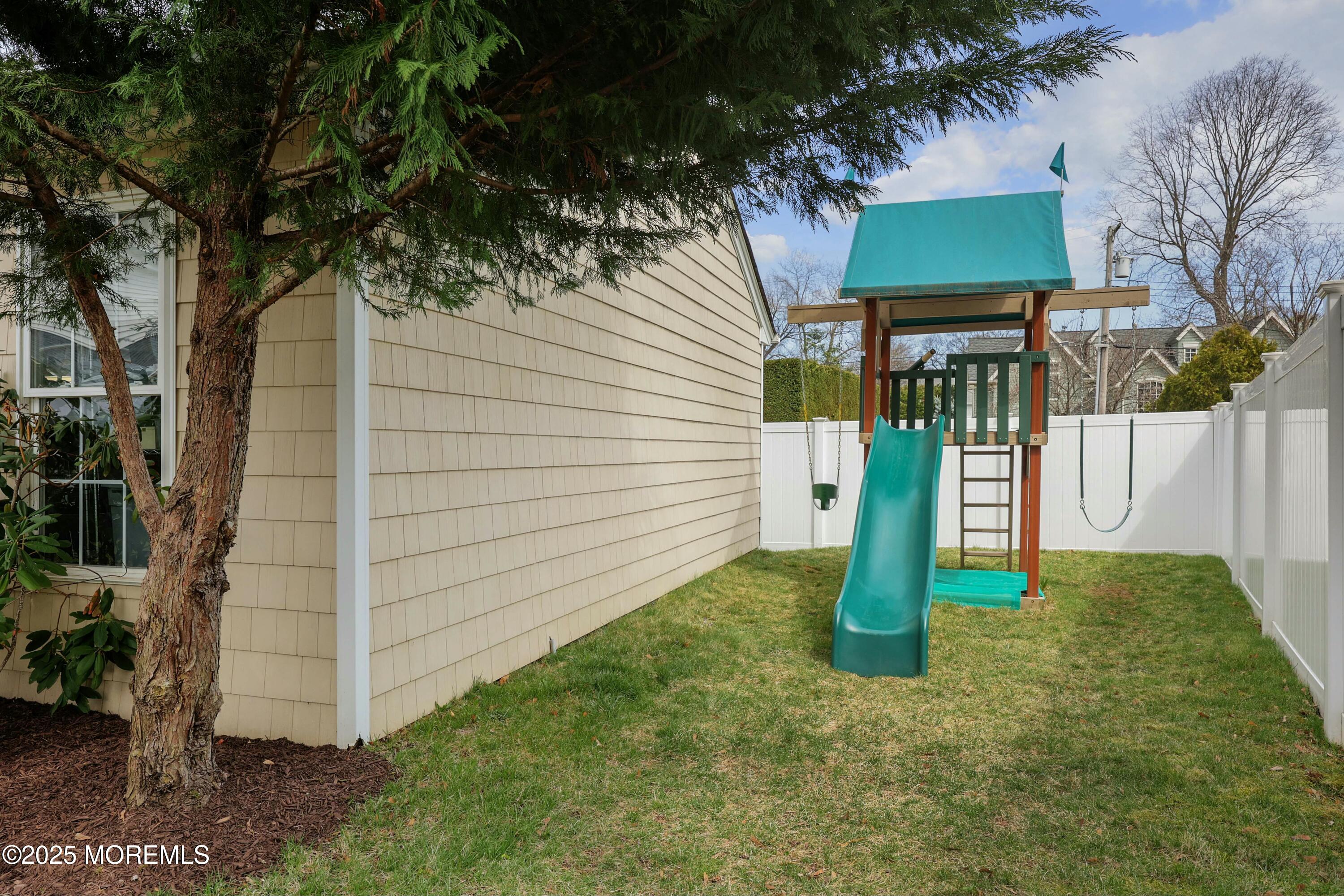 105 Black Point Road Rumson, NJ 07760 - Photo 29 of 33 a front view of a house with a yard