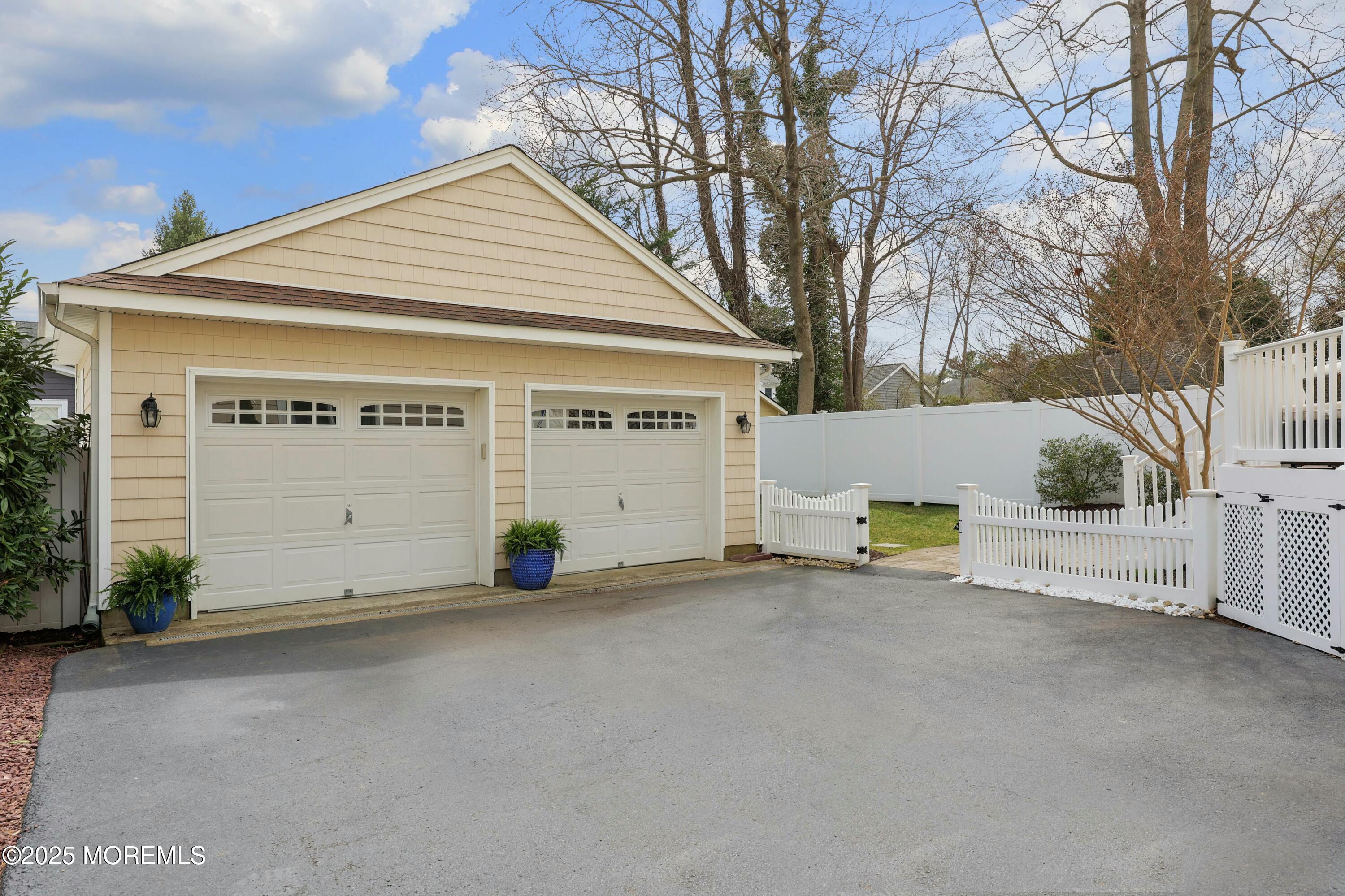 105 Black Point Road Rumson, NJ 07760 - Photo 30 of 33 a view of a house with a yard and garage