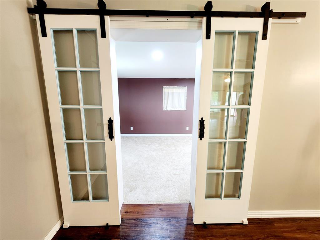 3514 Buchanan Loop Road Texarkana, TX 75501 - Photo 21 of 40 a room with wooden floor and windows