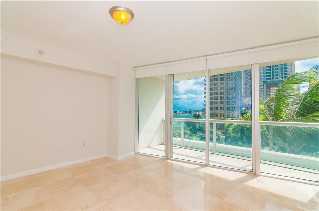465 Brickell Avenue, Unit BAY 419 Miami, FL 33131 - Photo 19 of 54 a view of a room with window and tree