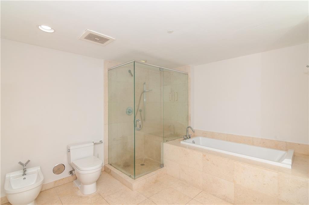 465 Brickell Avenue, Unit BAY 419 Miami, FL 33131 - Photo 28 of 54 a bathroom with a toilet and shower
