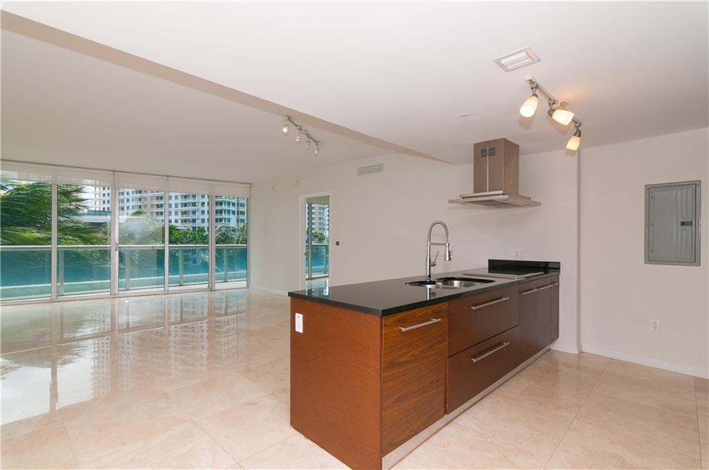 465 Brickell Avenue, Unit BAY 419 Miami, FL 33131 - Photo 7 of 54 a kitchen with stainless steel appliances granite countertop a stove and a sink