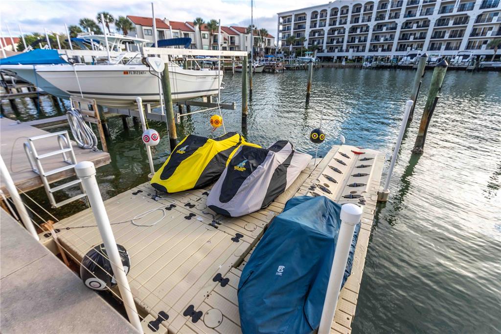 255 Dolphin Point, Unit 803 Clearwater Beach, FL 33767 - Photo 57 of 69 a view of a lake with a deck