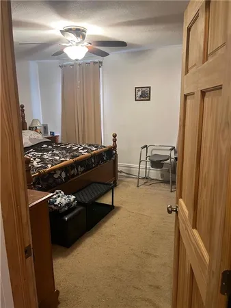 a bed sitting in a bedroom next to a window