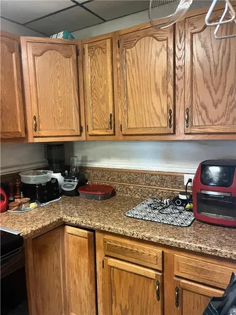 a living room with furniture rug and wooden floor