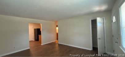 1070 Rulnick Street Fayetteville, NC 28304 - Photo 3 of 15 an empty room with wooden floor and closet