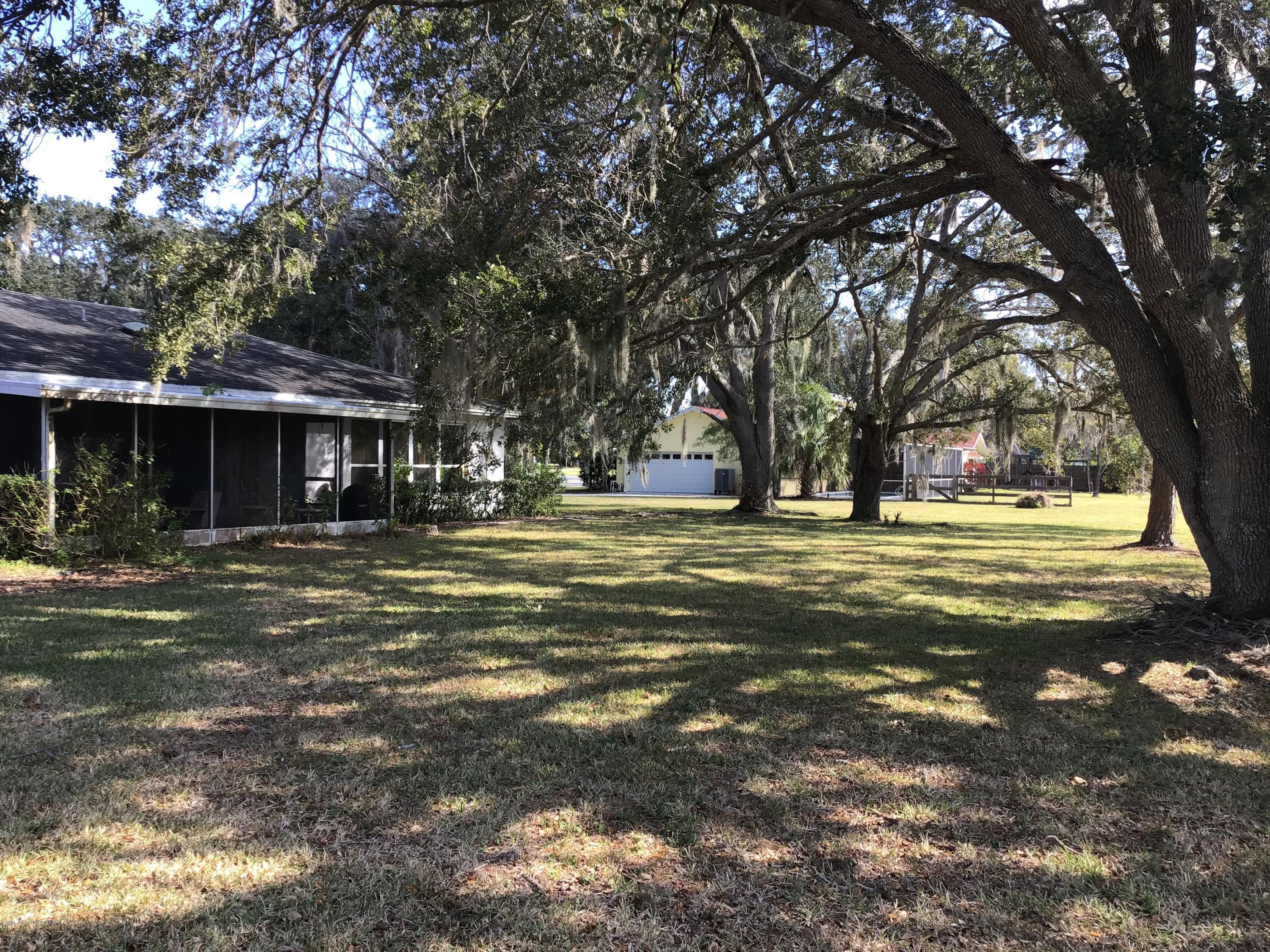 1350 Meadowbrook Road Northeast Palm Bay, FL 32905 - Photo 12 of 55 a view of a house with a yard