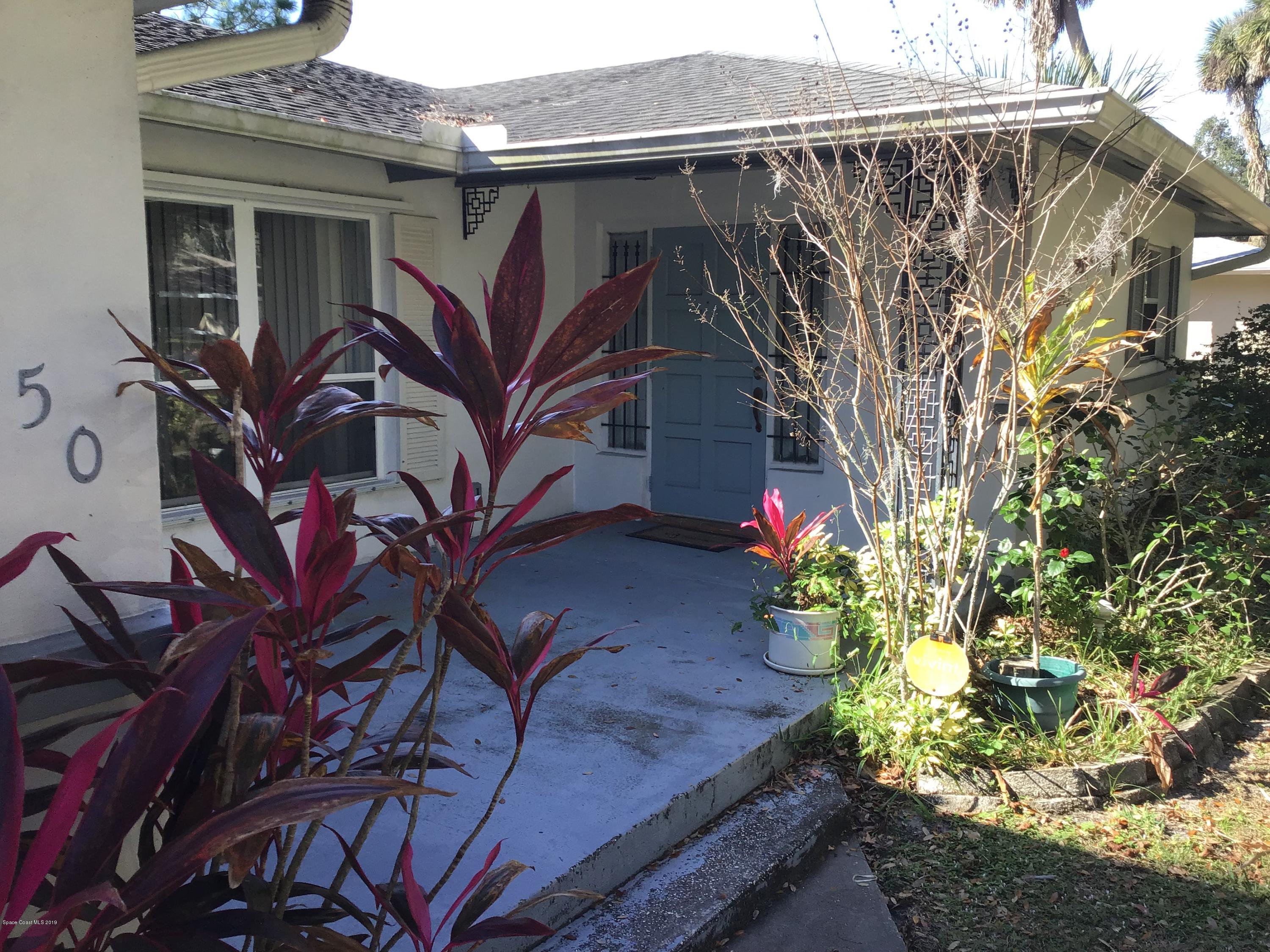 1350 Meadowbrook Road Northeast Palm Bay, FL 32905 - Photo 27 of 55 a view of a house with a tree