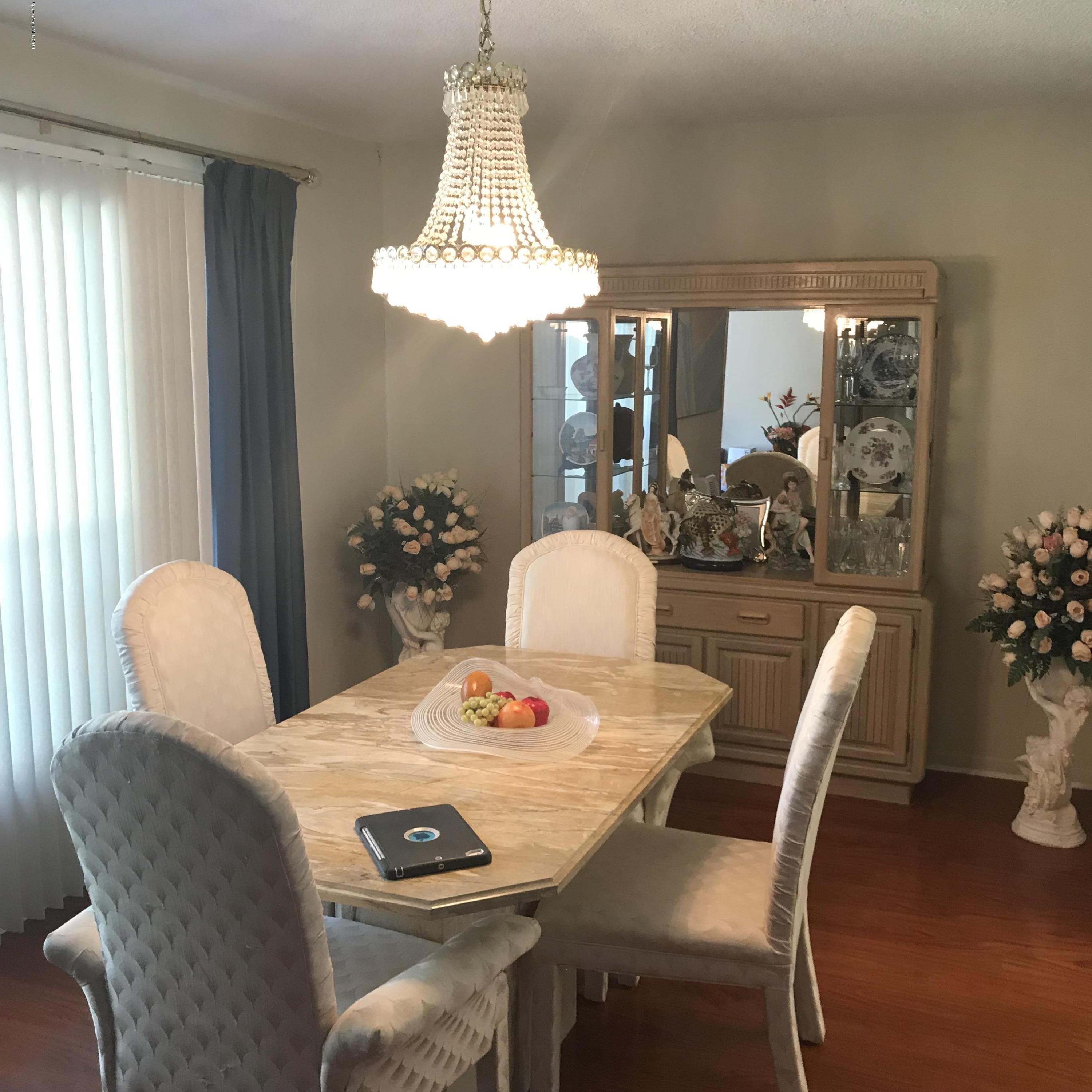 1350 Meadowbrook Road Northeast Palm Bay, FL 32905 - Photo 38 of 55 a view of a dining room with furniture window and outside view