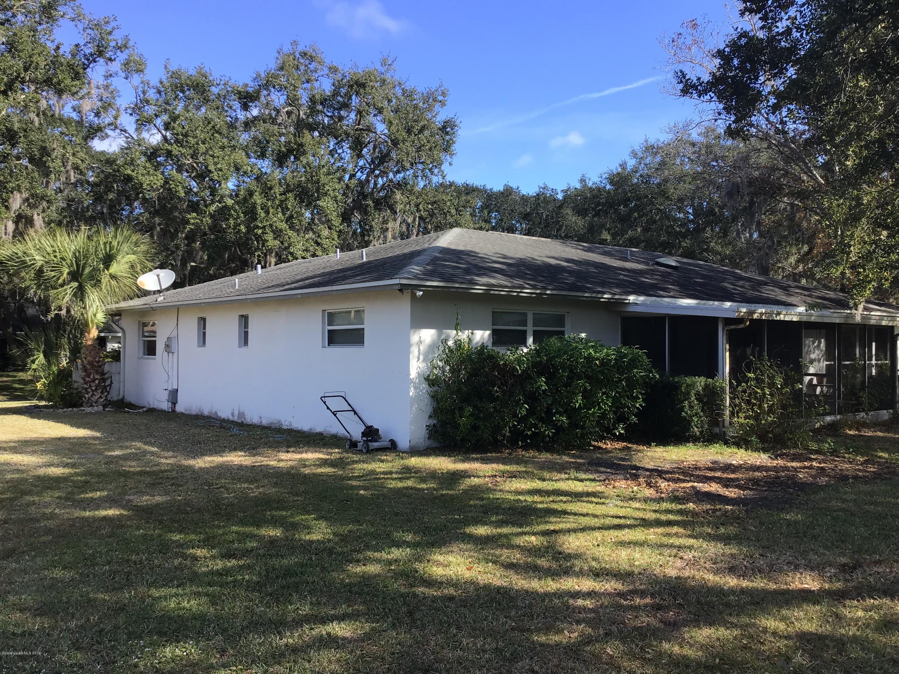 1350 Meadowbrook Road Northeast Palm Bay, FL 32905 - Photo 10 of 55 a view of a house with a yard