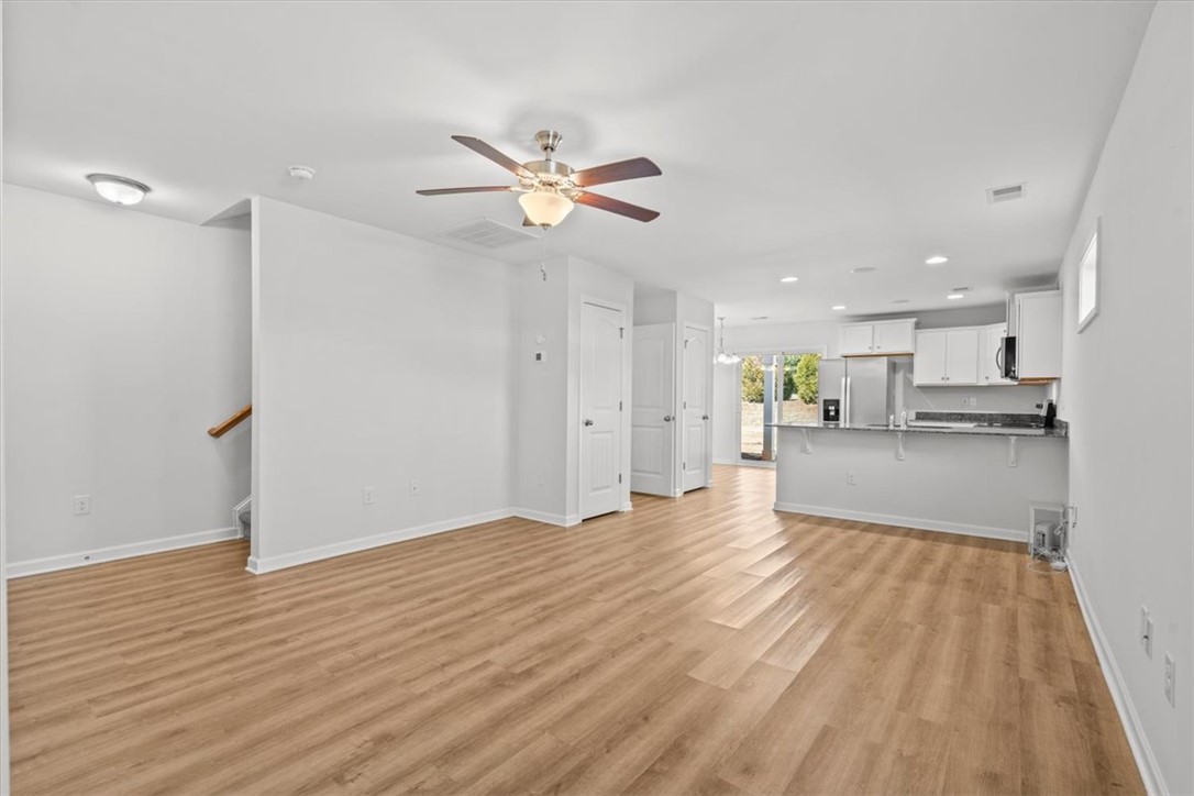 118 Adger Road Pendleton, SC 29670 - Photo 4 of 31 This bright, open-concept living area features a modern kitchen and durable flooring.