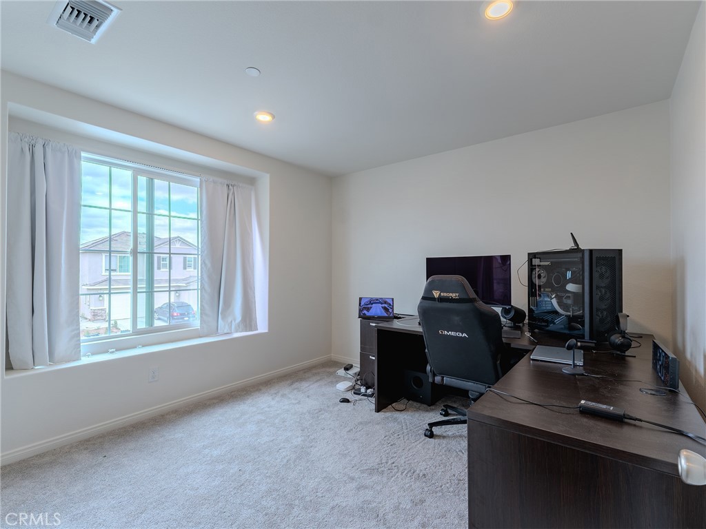 25602 Pne Rdg Road Homeland, CA 92548 - Photo 15 of 35 a view of a workspace with furniture and a window
