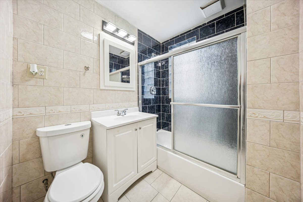 3134 West 39th Place, Unit 1 Chicago, IL 60632 - Photo 11 of 16 a bathroom with a toilet and a shower