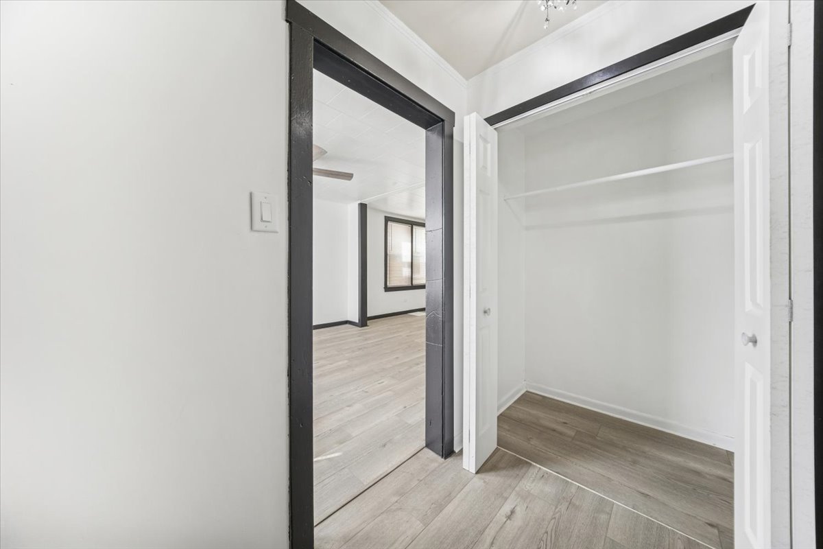 3134 West 39th Place, Unit 1 Chicago, IL 60632 - Photo 2 of 16 a view of a hallway with wooden floor and closet