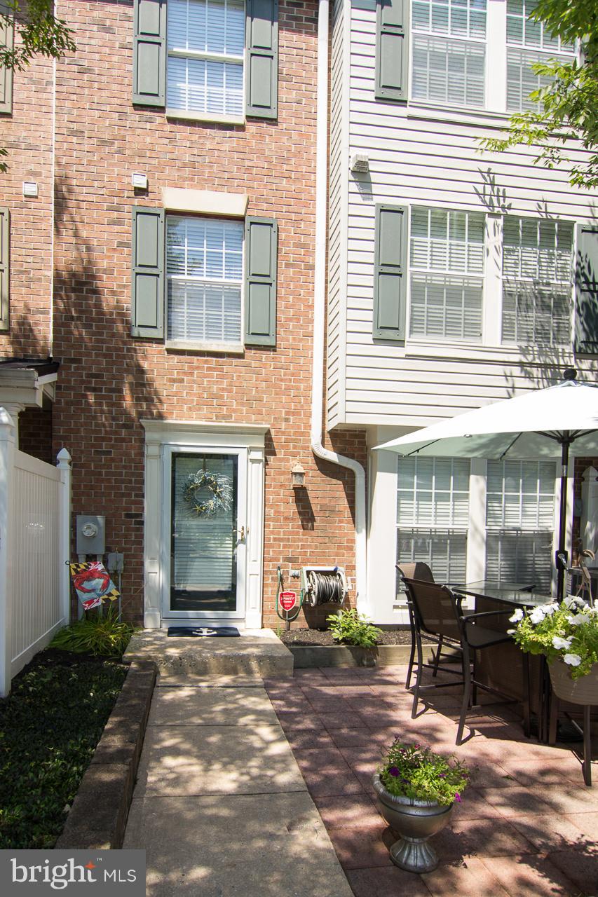 a backyard of a house with outdoor seating