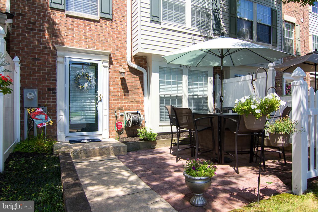 4122 Maple Path Circle, Unit 55 Baltimore, MD 21236 - Photo 2 of 27 a view of a house with a yard and sitting area