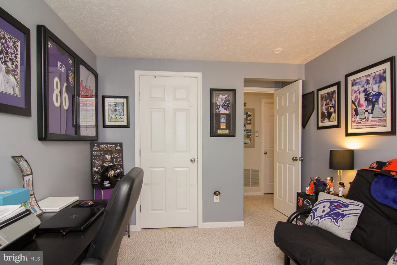 4122 Maple Path Circle, Unit 55 Baltimore, MD 21236 - Photo 19 of 27 a room with furniture and cabinets