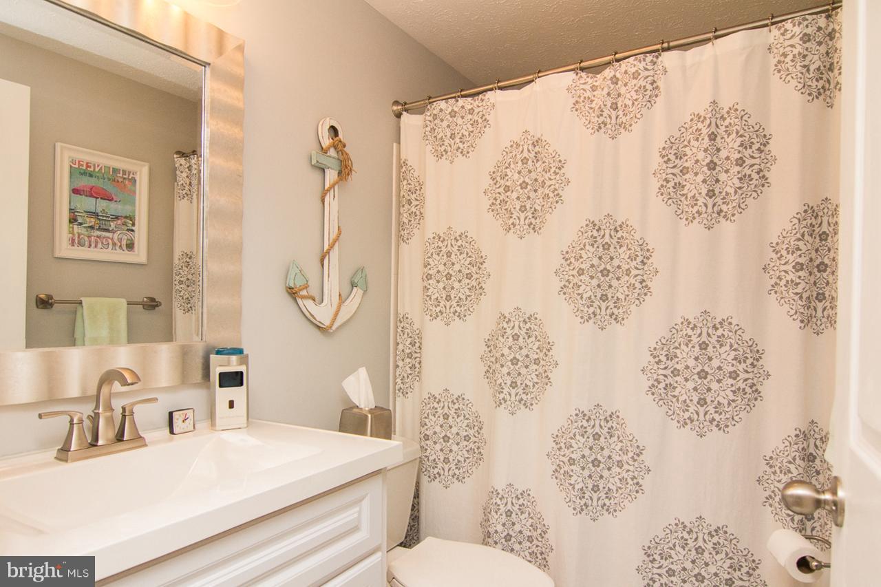 4122 Maple Path Circle, Unit 55 Baltimore, MD 21236 - Photo 27 of 27 a bathroom with a sink toilet and shower