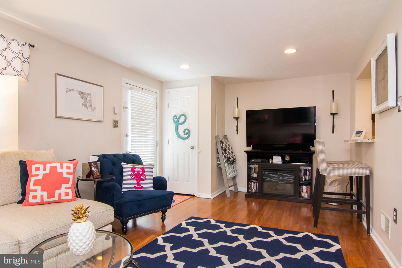4122 Maple Path Circle, Unit 55 Baltimore, MD 21236 - Photo 4 of 27 a living room with furniture and a flat screen tv