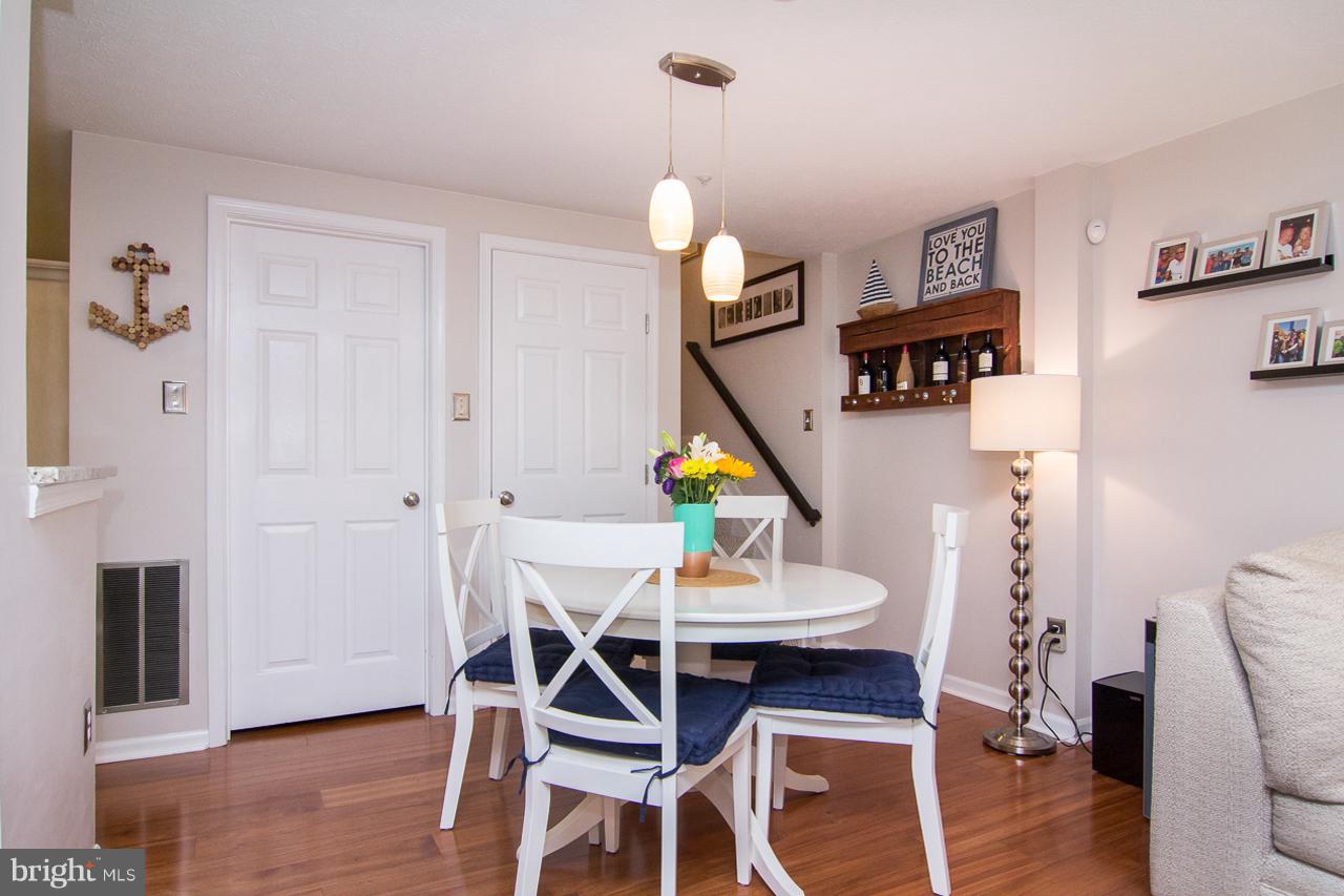 4122 Maple Path Circle, Unit 55 Baltimore, MD 21236 - Photo 5 of 27 a dining room with furniture and wooden floor