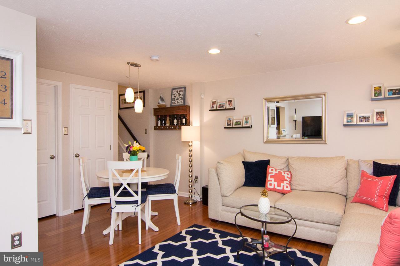 4122 Maple Path Circle, Unit 55 Baltimore, MD 21236 - Photo 6 of 27 a living room with furniture a wooden floor and next to a window