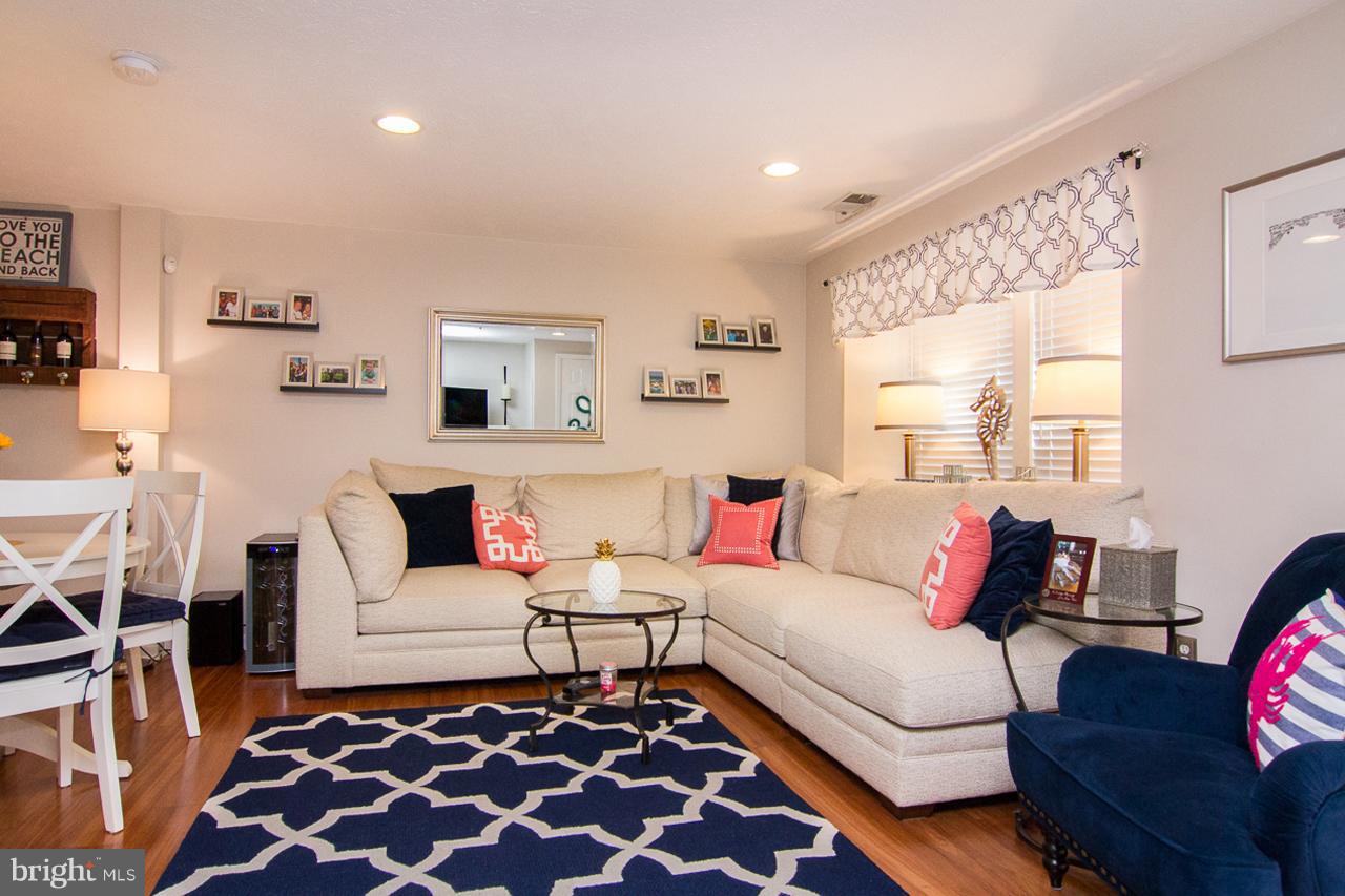 4122 Maple Path Circle, Unit 55 Baltimore, MD 21236 - Photo 7 of 27 a living room with furniture and a rug