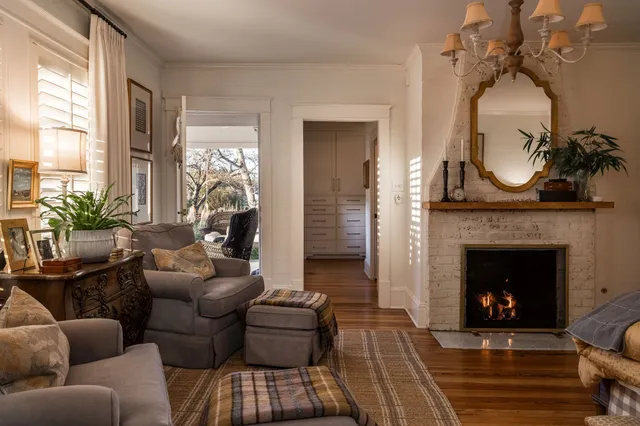 a bathroom with a granite countertop sink and a large mirror