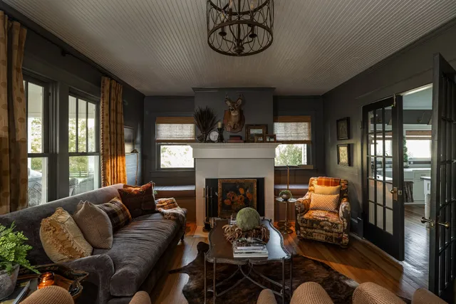 a kitchen with stainless steel appliances cabinets and a book shelf