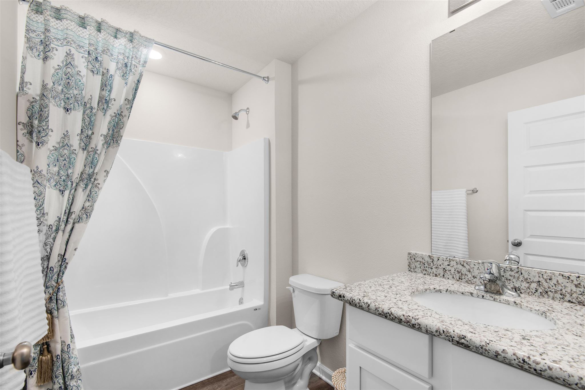 5105 Conservation Circle Pace, FL 32571 - Photo 12 of 24 a bathroom with a granite countertop sink toilet and shower