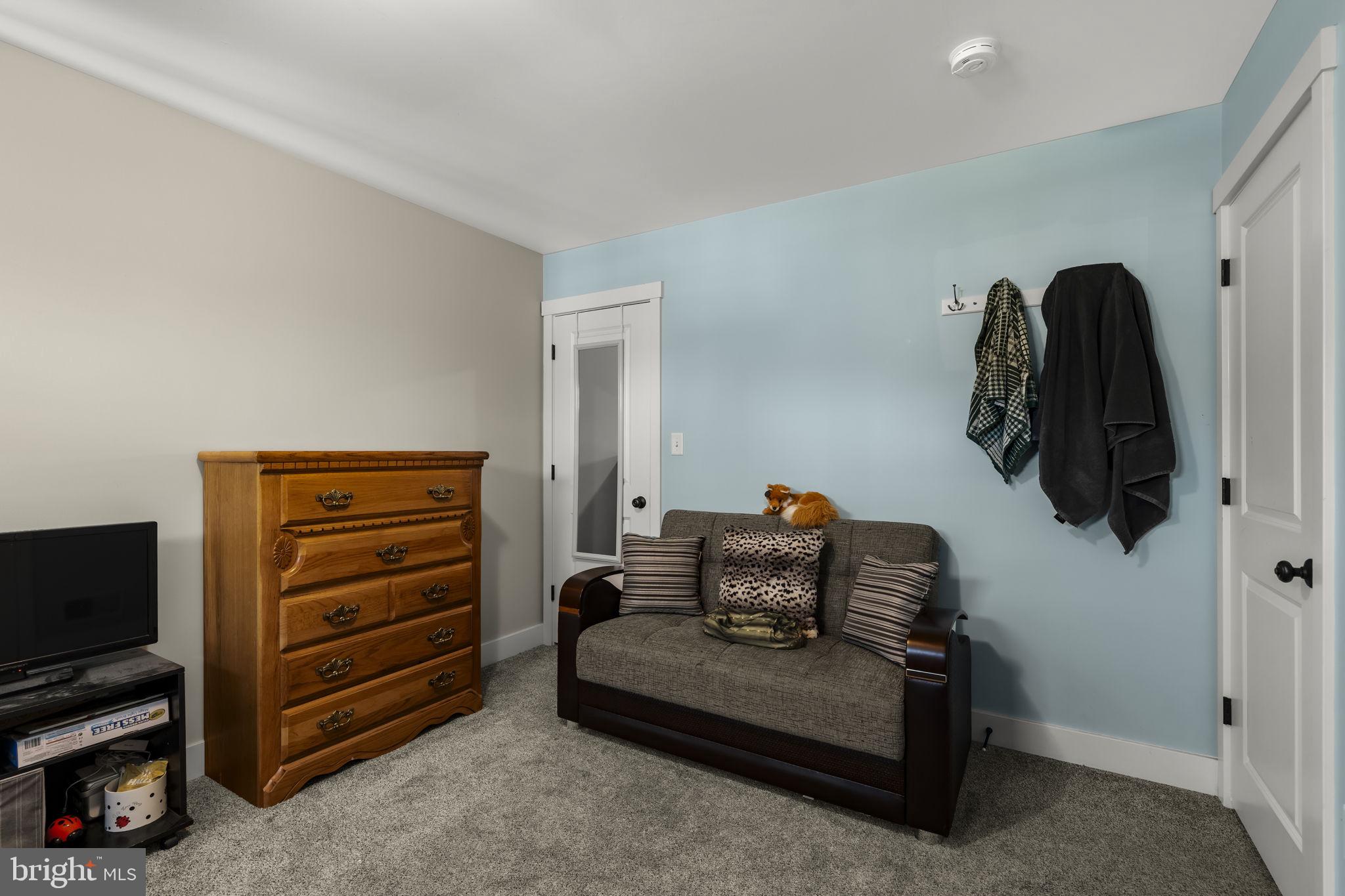 744 Lime Quarry Road Gap, PA 17527 - Photo 49 of 76 a bedroom with furniture and a flat screen tv