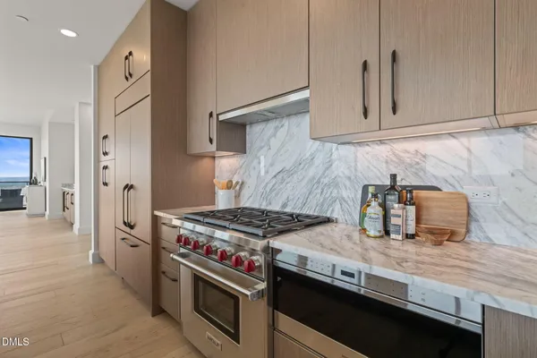 a living room with furniture and large windows
