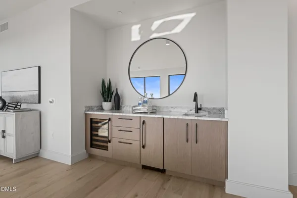 a view of a room that has a table and chairs in it