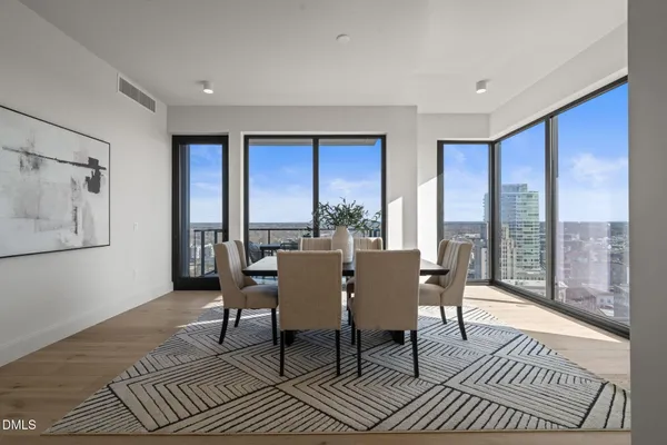 a bedroom with a large bed and a lamp on table