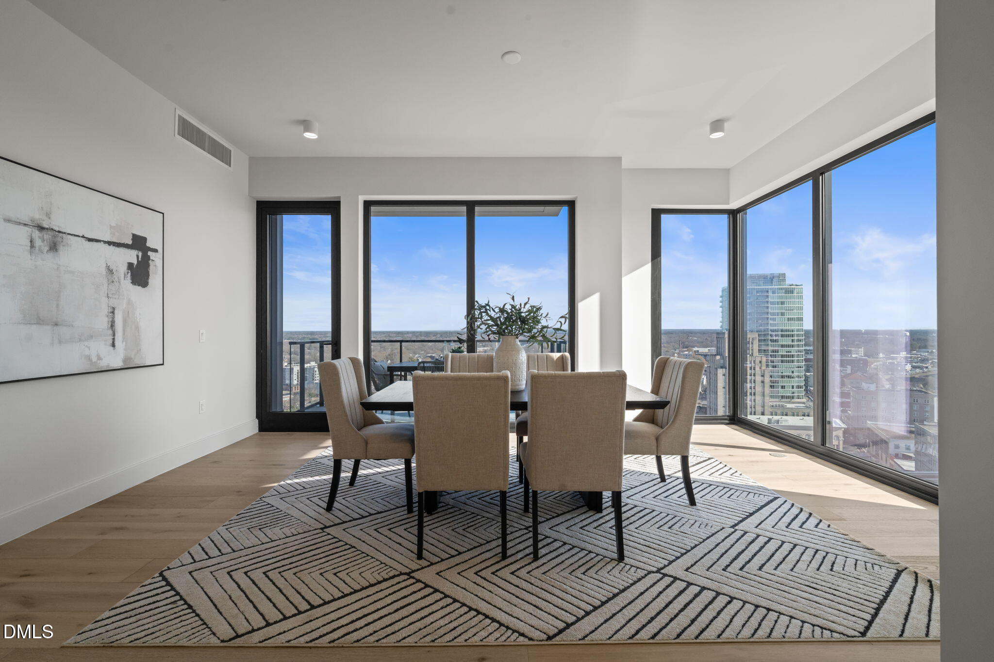 115 Morris Street, Unit 2205 Durham, NC 27701 - Photo 30 of 83 a dining room with furniture a rug and wooden floor