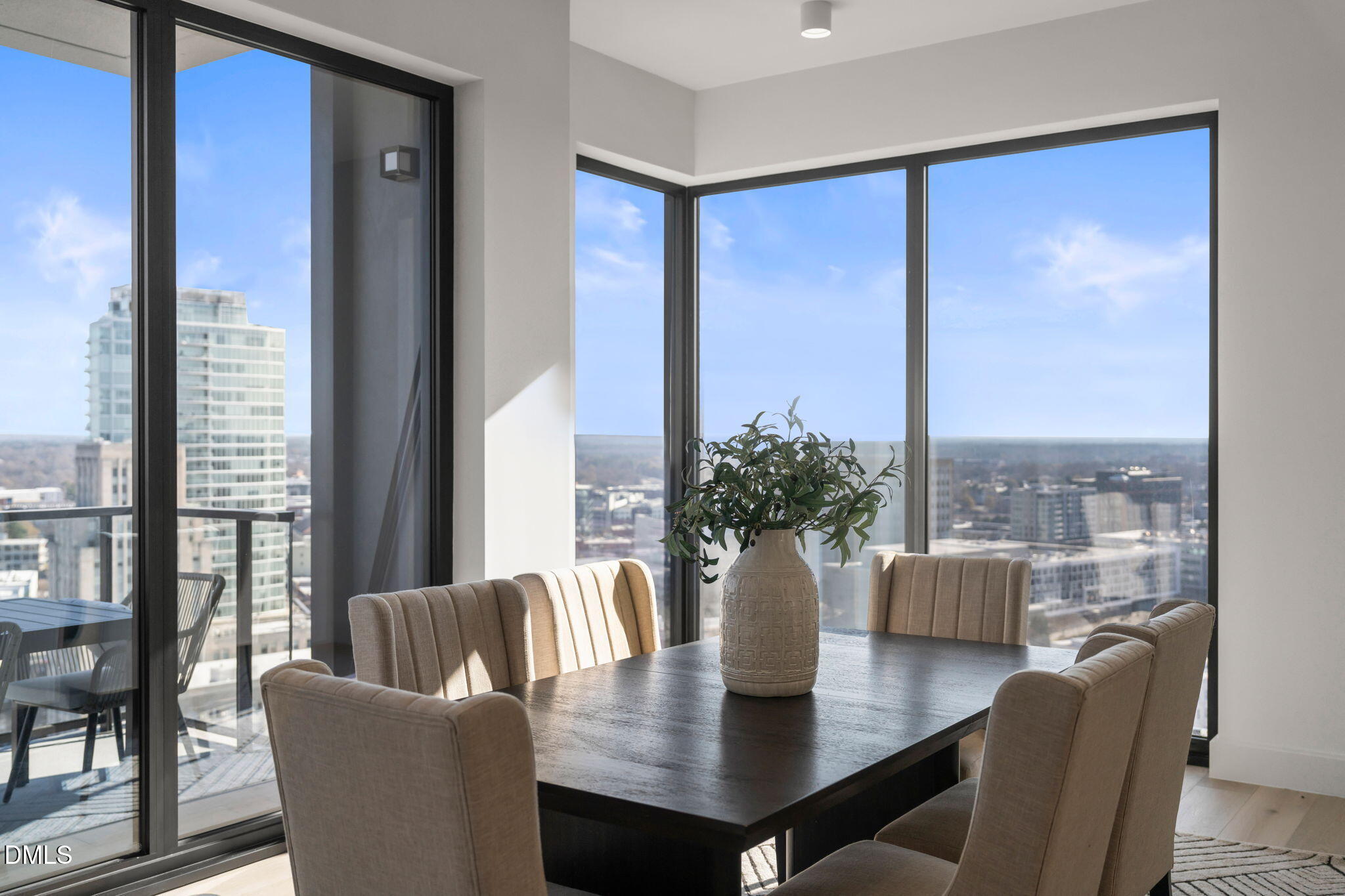 115 Morris Street, Unit 2205 Durham, NC 27701 - Photo 31 of 83 a view of a dining room with furniture window and wooden floor