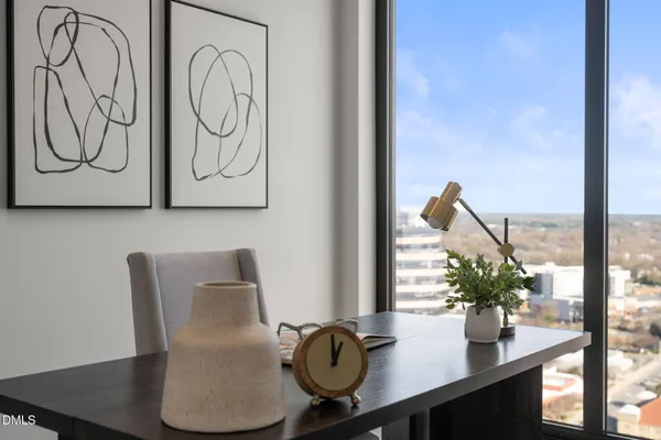 a bedroom with a bed and lamp