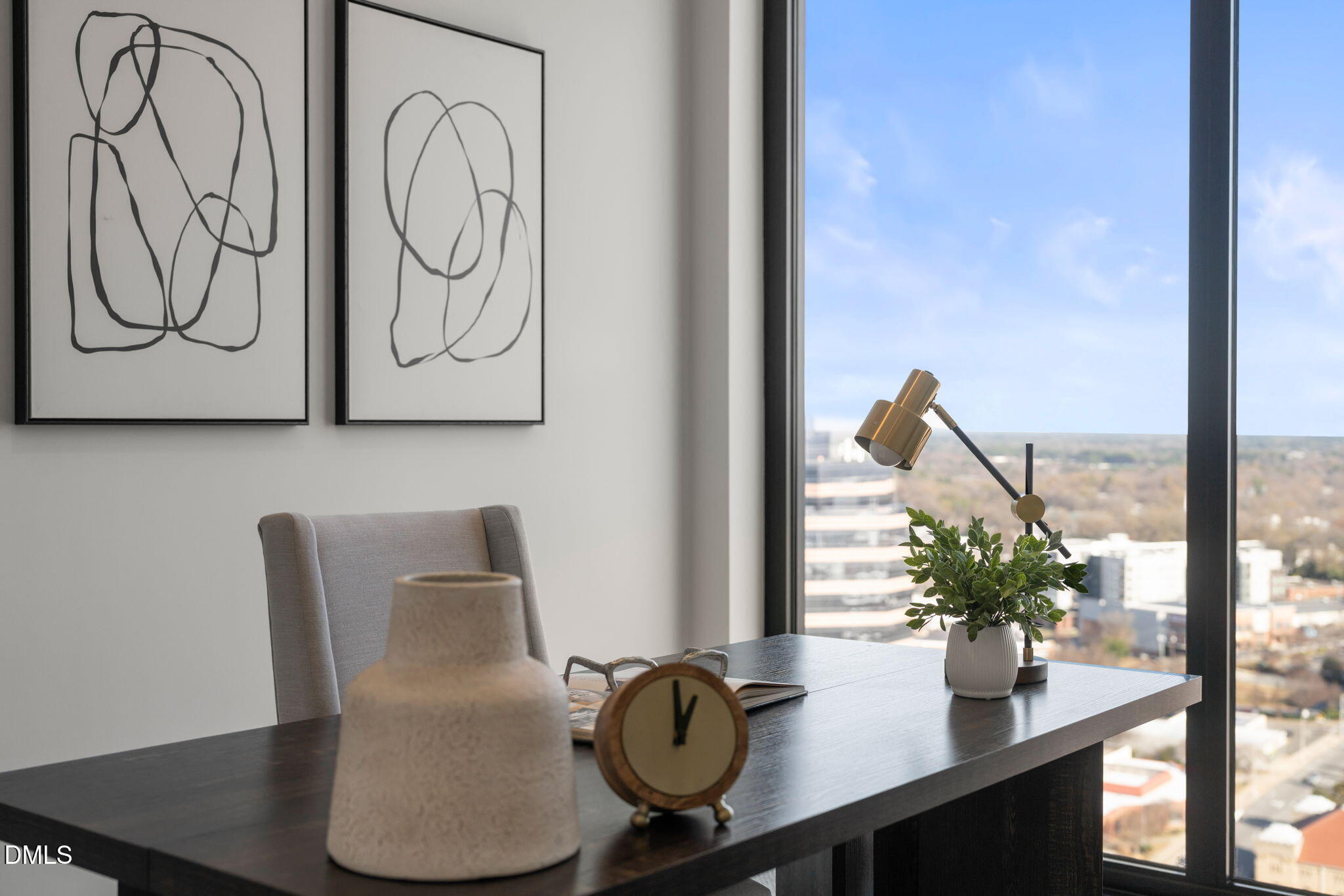 115 Morris Street, Unit 2205 Durham, NC 27701 - Photo 34 of 83 a table with a vase and flowers on it