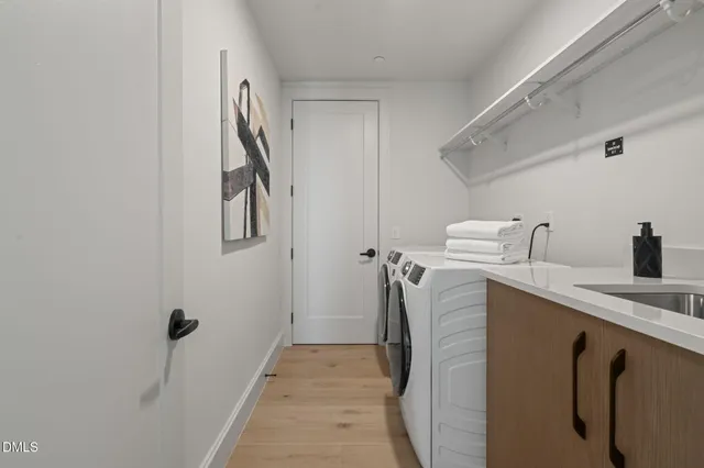 a view of a bedroom with wooden floor