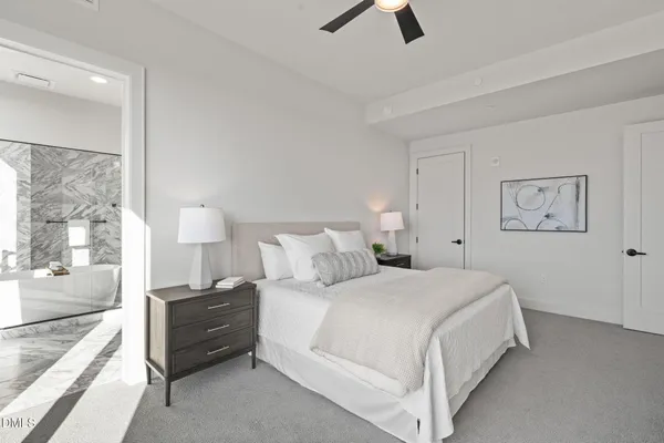 a view of a hallway with wooden floor and closet area